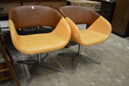 A pair of stylish swivel chairs.