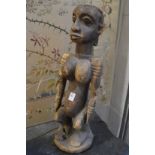 A large carved wood African female figure.