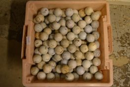 A large quantity of used golf balls.