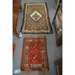 Two small woollen rugs, 70cm x 53cm and 125cm x 80cm.