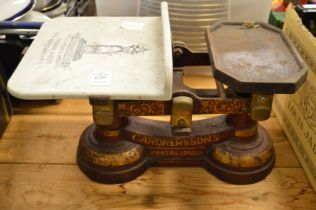 Gardner & Sons, a set of cast iron and porcelain scales.
