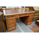 A Victorian oak pedestal desk.