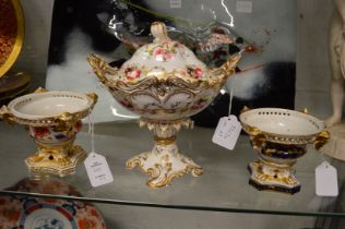 A floral and gilt decorated porcelain pedestal sauce tureen and cover together with a pair of