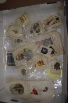 A quantity of silk cigarette cards, unframed.