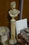 A classical Roman style bust on fluted column support.