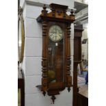 A walnut cased Vienna regulator wall clock.