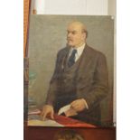 Russian School, Lenin standing by a table a letter in his hand, oil on canvas, unframed.