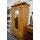 A satin walnut wardrobe.