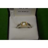 An 18ct white and yellow gold gem set ring, size L½.