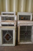 Sixteen various framed leaded lights with stained glass decoration.