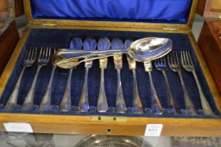 Cased set of six plated fish knives and forks and four plated spoons.