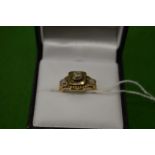 A 9ct gold ring, set with three stones, size I½.