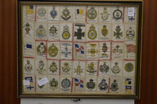 Collection of military silk cigarette cards framed and glazed.