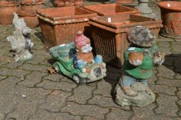 Three garden gnomes.
