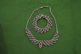 A decorative necklace with matching bracelet.