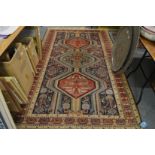 A good Persian rug, blue ground with stylised decoration and various animals and birds, 270cm x