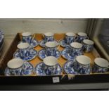 A collection of Japanese blue and white coffee cups and saucers.