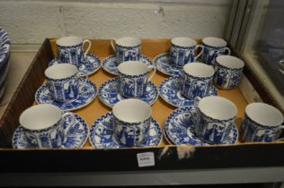 A collection of Japanese blue and white coffee cups and saucers.