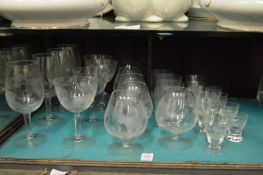 A collection of glassware, engraved and etched with African animals in landscapes.