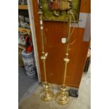 A pair of brass standard lamps.