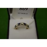An 18ct white gold, diamond and sapphire seven stone ring, size N½.
