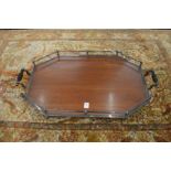 A good mahogany twin handled tray with plated mounts.