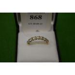 An 18ct gold and diamond seven stone ring, size Q.