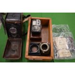 A Rolleiflex camera with original leather case and accessories etc.