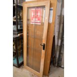 A hardwood framed leaded glazed door.