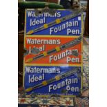 An enamel sign 'Watermans Ideal Fountain Pen', three rows of text and images in blue, red and blue.