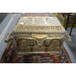 An ornate Eastern embossed metal casket.