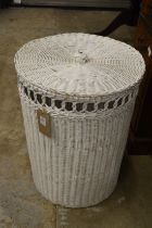 A wicker laundry basket.