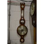 A mahogany barometer/thermometer.