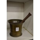 A brass pestle and mortar.