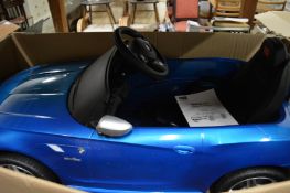 Child's battery operated BMW Z4 car, boxed.