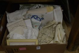 A box of decorative textiles.