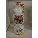 An armorial decorated porcelain liqueur bottle.