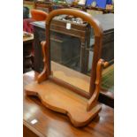 A Victorian mahogany toilet mirror.