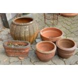 Five various terracotta plant pots.