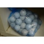 A bag fifty Maxfli golf balls.