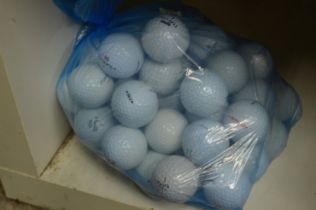 A bag fifty Maxfli golf balls.