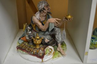 A Capodimonte figure of an Arab street vendor.