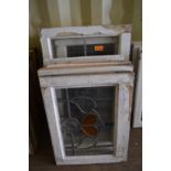 Ten various framed leaded lights with stained glass decoration.