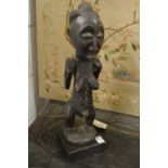 African carved wood fertility figure of a woman.