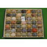 A set of miniature hardstone eggs.