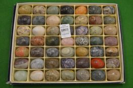 A set of miniature hardstone eggs.