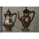 A silver coffee pot and matching hot water jug.