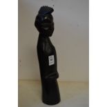 A stylised carved wood tribal figure.