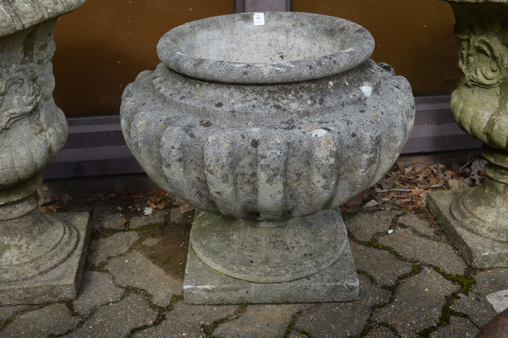 A good large reconstituted stone pedestal planter.
