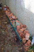 A large quantity of terracotta and other plant pots.